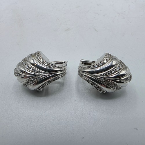 26 - An unmarked yellow and white metal diamond set metamorphic earing set in fitted felt lined case with... 