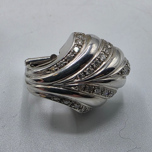 26 - An unmarked yellow and white metal diamond set metamorphic earing set in fitted felt lined case with... 