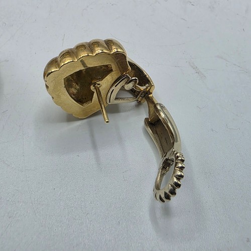 26 - An unmarked yellow and white metal diamond set metamorphic earing set in fitted felt lined case with... 