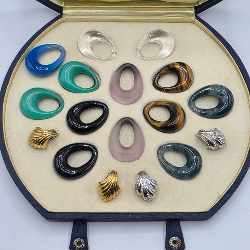 26 - An unmarked yellow and white metal diamond set metamorphic earing set in fitted felt lined case with... 