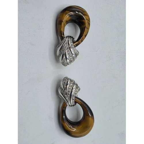 26 - An unmarked yellow and white metal diamond set metamorphic earing set in fitted felt lined case with... 