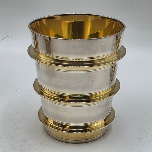 27 - A set of twelve  Sterling silver gilt water beakers with gilt ribbed design and interiors each 9.5 c... 