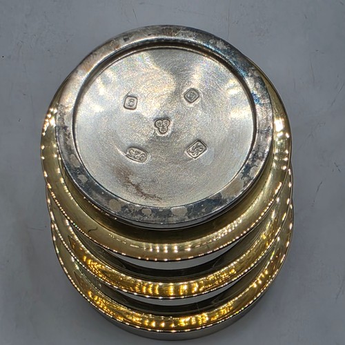 27 - A set of twelve  Sterling silver gilt water beakers with gilt ribbed design and interiors each 9.5 c... 