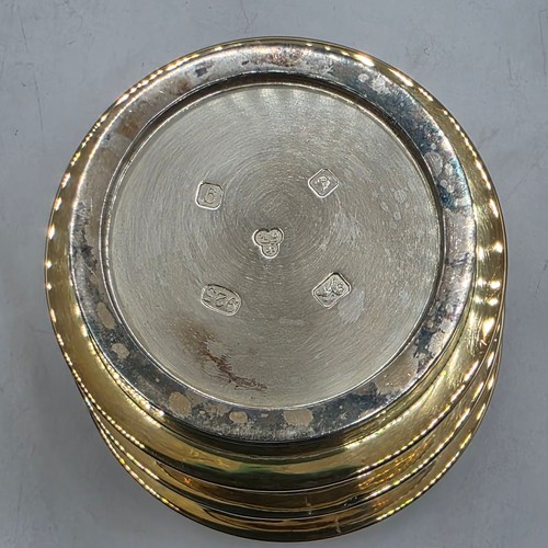 27 - A set of twelve  Sterling silver gilt water beakers with gilt ribbed design and interiors each 9.5 c... 