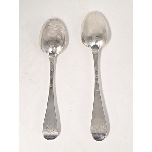 31 - Two 18th century sterling silver spoons with worn marks 128 g