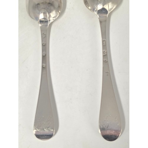 31 - Two 18th century sterling silver spoons with worn marks 128 g