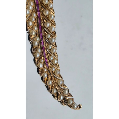 25 - An unmarked yellow metal pearl and ruby Fern Brooch set with graduated line of channel set rubies an... 