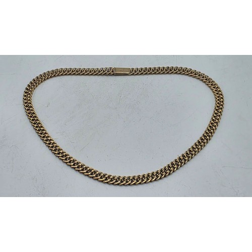 24 - An unmarked yellow metal flat fancy link necklace 44 cm 35.5 g