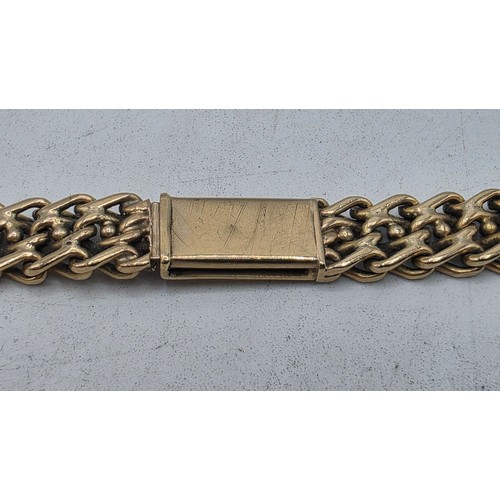 24 - An unmarked yellow metal flat fancy link necklace 44 cm 35.5 g