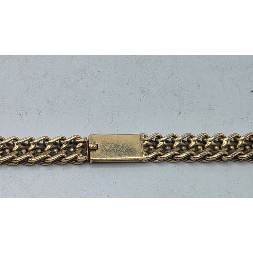 24 - An unmarked yellow metal flat fancy link necklace 44 cm 35.5 g
