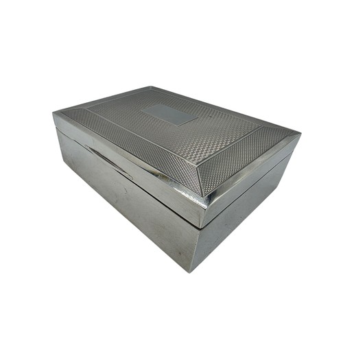 21 - A sterling silver cedar lined cigarette box with engine turned decoration.  Harman Brothers Birmingh... 