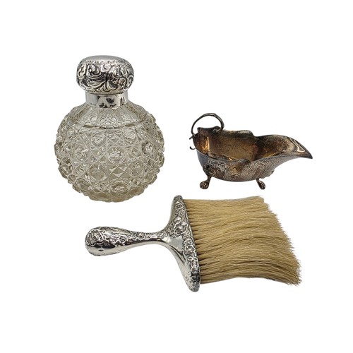 22 - A collection of sterling silver items to include small sauceboat, silver topped glass scent bottle &... 