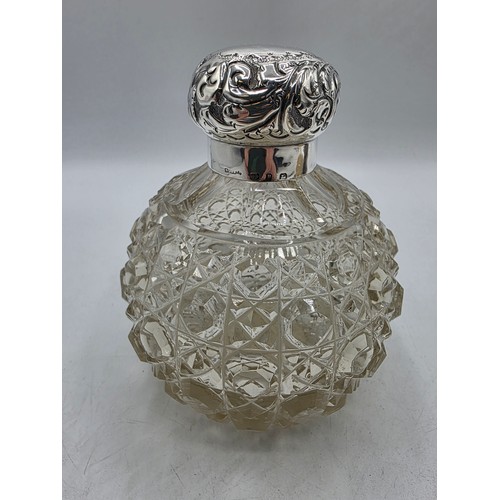 22 - A collection of sterling silver items to include small sauceboat, silver topped glass scent bottle &... 
