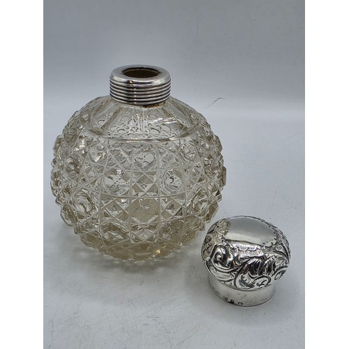 22 - A collection of sterling silver items to include small sauceboat, silver topped glass scent bottle &... 
