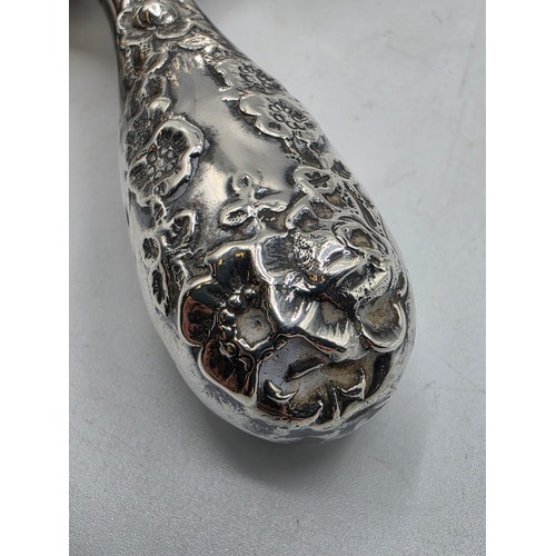 22 - A collection of sterling silver items to include small sauceboat, silver topped glass scent bottle &... 