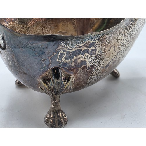 22 - A collection of sterling silver items to include small sauceboat, silver topped glass scent bottle &... 