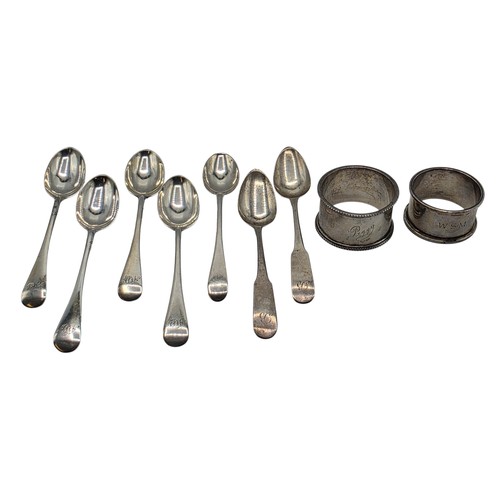 33 - A collection of sterling silver tea spoons with two sterling napkin rings 178 g