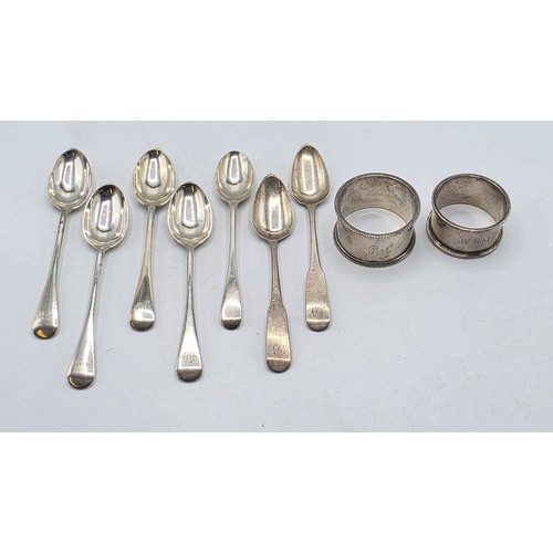 33 - A collection of sterling silver tea spoons with two sterling napkin rings 178 g