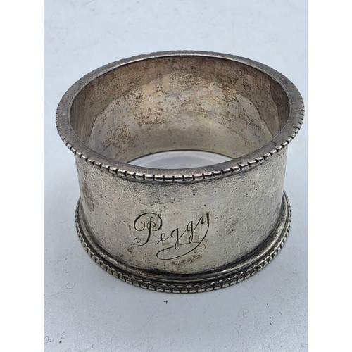 33 - A collection of sterling silver tea spoons with two sterling napkin rings 178 g