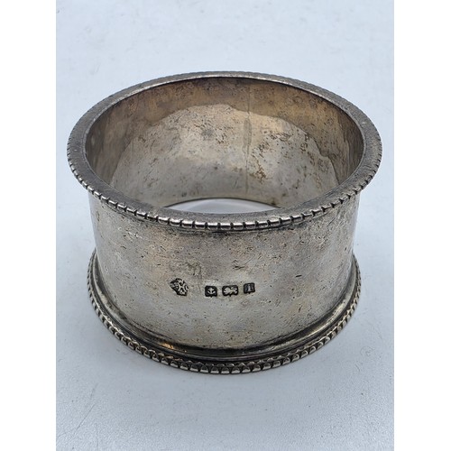 33 - A collection of sterling silver tea spoons with two sterling napkin rings 178 g