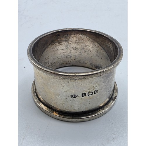 33 - A collection of sterling silver tea spoons with two sterling napkin rings 178 g