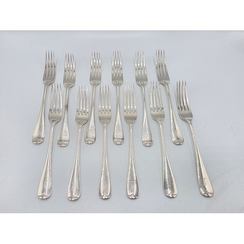 30 - A set of twelve sterling silver dining forks by Goldsmith and Silversmith Company London 1905.  775 ... 