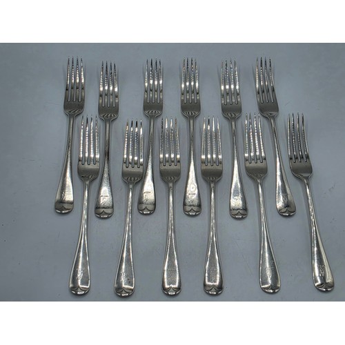 30 - A set of twelve sterling silver dining forks by Goldsmith and Silversmith Company London 1905.  775 ... 