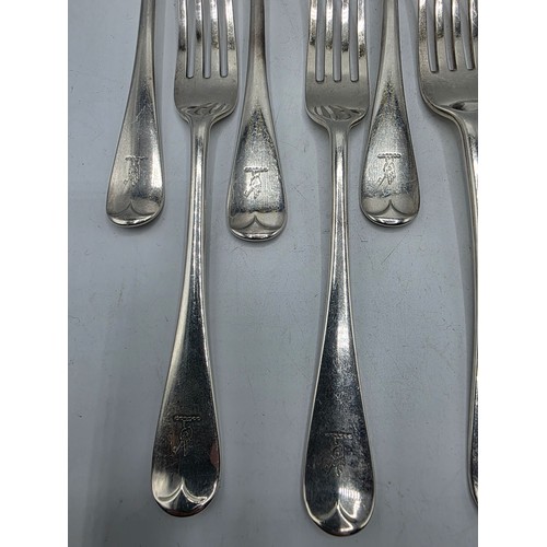 30 - A set of twelve sterling silver dining forks by Goldsmith and Silversmith Company London 1905.  775 ... 