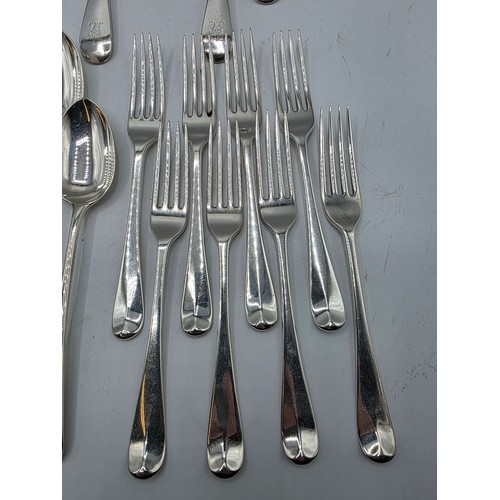 28 - A collection of sterling silver flatware, to include 8 desert forks, 12 desert spoons, 11 serving sp... 