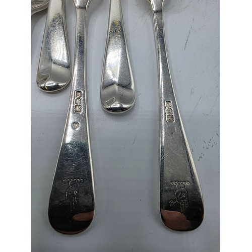 28 - A collection of sterling silver flatware, to include 8 desert forks, 12 desert spoons, 11 serving sp... 