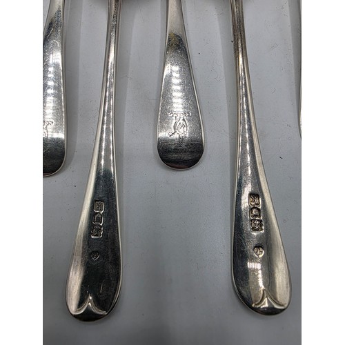 28 - A collection of sterling silver flatware, to include 8 desert forks, 12 desert spoons, 11 serving sp... 