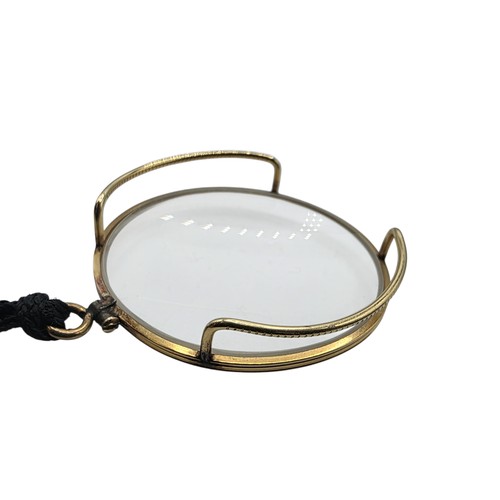 36 - An unmarked yellow metal monocle
