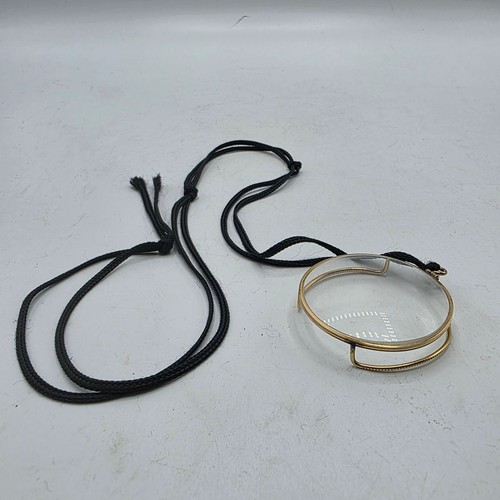 36 - An unmarked yellow metal monocle