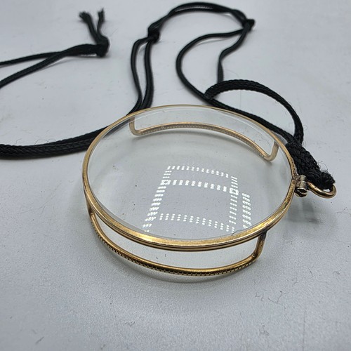 36 - An unmarked yellow metal monocle
