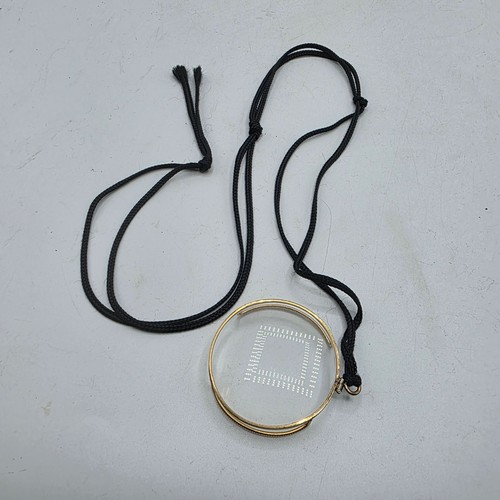 36 - An unmarked yellow metal monocle