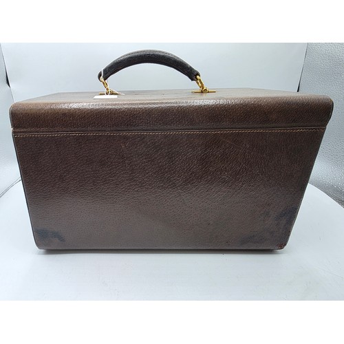23 - A vintage Gucci leather jewellery travel case with green felt lined interior 34 cm x 19 cm x 20 cm H