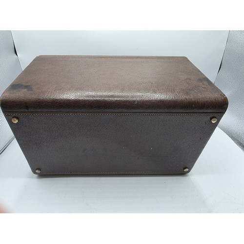 23 - A vintage Gucci leather jewellery travel case with green felt lined interior 34 cm x 19 cm x 20 cm H