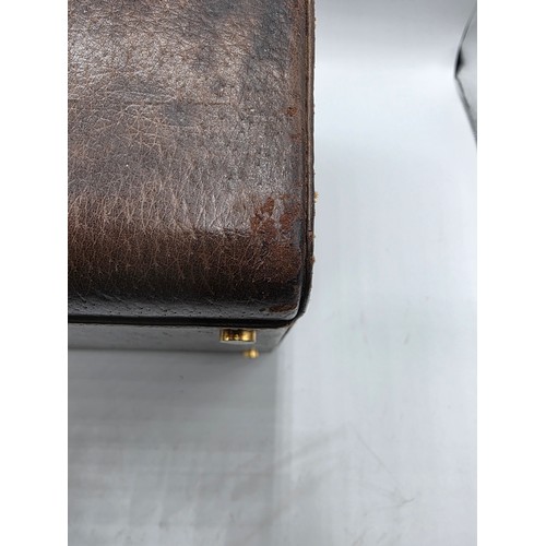 23 - A vintage Gucci leather jewellery travel case with green felt lined interior 34 cm x 19 cm x 20 cm H