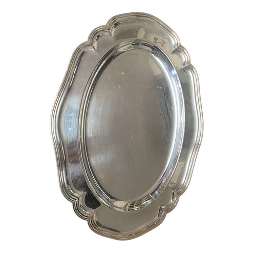 50 - A collection of silver plated wares to include a large cloche.