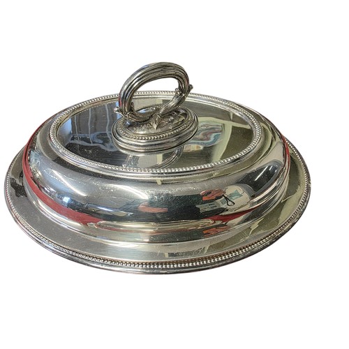 50 - A collection of silver plated wares to include a large cloche.