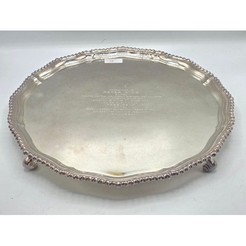38 - A large sterling silver tray with cast rim and on four scroll feet. 36cm(d). By CJ Vander Ltd Sheffi... 
