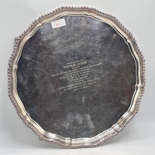 38 - A large sterling silver tray with cast rim and on four scroll feet. 36cm(d). By CJ Vander Ltd Sheffi... 