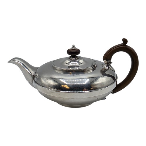 37 - A pair of Georgian sterling silver teapots of squashed globular form, by  WE, London, 1831. 1296g.