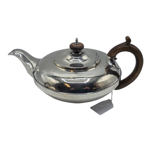 37 - A pair of Georgian sterling silver teapots of squashed globular form, by  WE, London, 1831. 1296g.