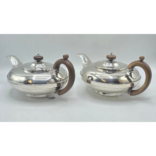 37 - A pair of Georgian sterling silver teapots of squashed globular form, by  WE, London, 1831. 1296g.