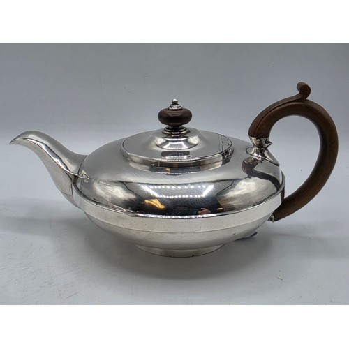 37 - A pair of Georgian sterling silver teapots of squashed globular form, by  WE, London, 1831. 1296g.