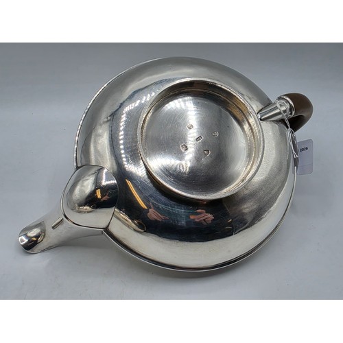 37 - A pair of Georgian sterling silver teapots of squashed globular form, by  WE, London, 1831. 1296g.