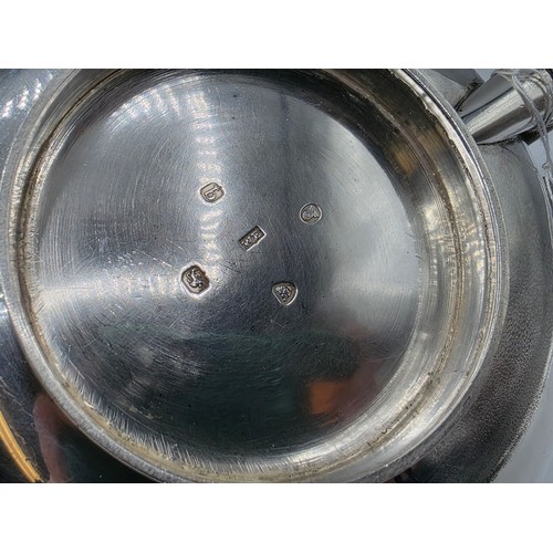 37 - A pair of Georgian sterling silver teapots of squashed globular form, by  WE, London, 1831. 1296g.