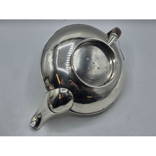 37 - A pair of Georgian sterling silver teapots of squashed globular form, by  WE, London, 1831. 1296g.