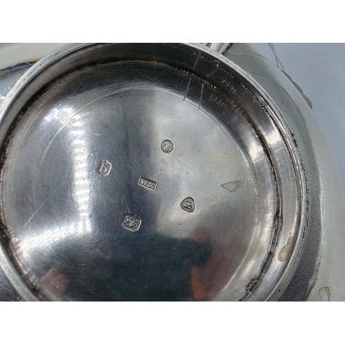 37 - A pair of Georgian sterling silver teapots of squashed globular form, by  WE, London, 1831. 1296g.